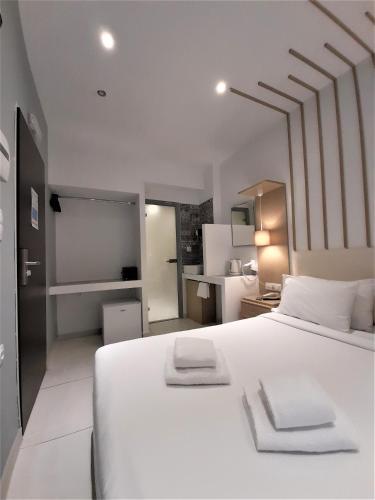 Postel nebo postele na pokoji v ubytování Elite Hotel