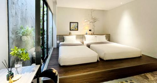 Cama o camas de una habitación en Côn Đảo House