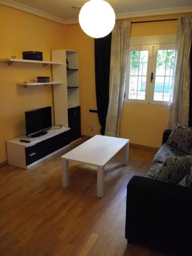 a living room with a couch and a coffee table at Ávila Flats Pz Ejército Avila in Ávila