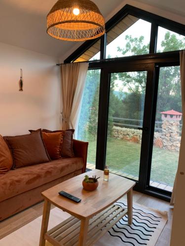 a living room with a couch and a table at Kairos Hotel in Kas