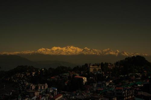 a view of a city with mountains in the background at Sumitel Vista 800m from Mall Road in Darjeeling