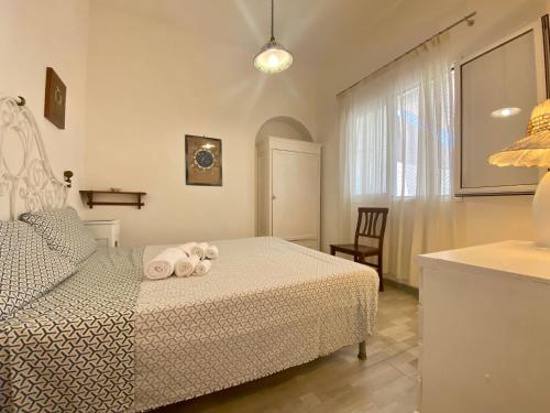 A bed or beds in a room at VILLA OASI a 50 mt dalla spiaggia