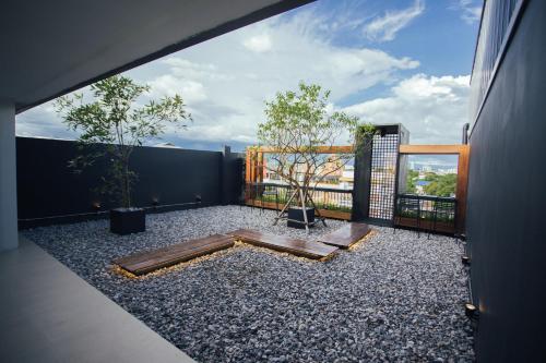 a balcony with a view of a building at DUM Hotel - Si Phum in Chiang Mai