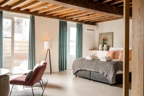 En eller flere senge i et værelse på Bossche Suites No2 - Verwersstraat