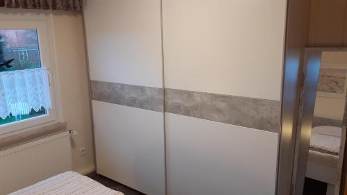 Ванная комната в Grosszügige Wohnung für 4 Personen in Ostfriesland mit E- Ladesäule