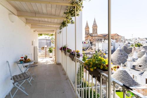 a balcony with a view of the city at Palazzo Scotto in Alberobello