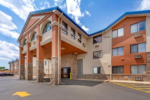 a building with a parking lot in front of it at Econo Lodge Black Hills in Rapid City