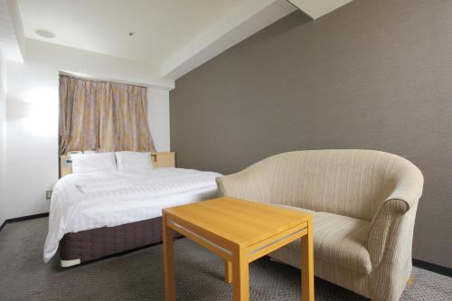 尼崎セントラルホテルにあるベッド