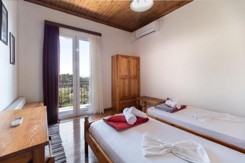 Säng eller sängar i ett rum på La Olga Apartment Lefkada