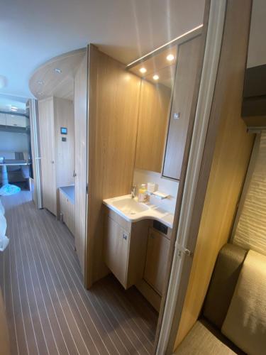a bathroom with a sink and a mirror at Fagervik Camping in Tresfjord