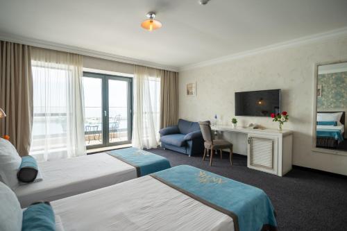 Llit o llits en una habitació de Hotel Antik