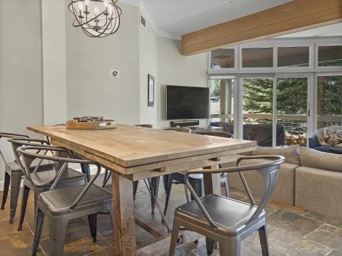 a dining room with a wooden table and chairs at B11 Powder Run condo in Park City