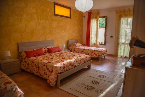 Ένα ή περισσότερα κρεβάτια σε δωμάτιο στο B&B Villa Passero