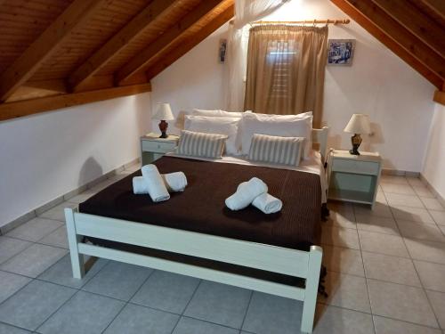 Postel nebo postele na pokoji v ubytování Marketos Apartments