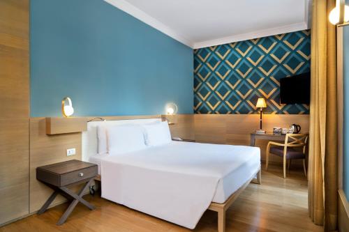 Ένα ή περισσότερα κρεβάτια σε δωμάτιο στο Grand Hotel Alassio Beach & Spa Resort - The Leading Hotels of the World
