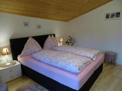 Un pat sau paturi într-o cameră la Appartementhaus Hochkönig 1 - Alpenrose