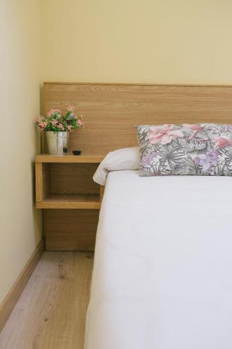 Ένα ή περισσότερα κρεβάτια σε δωμάτιο στο Hotel O Castro