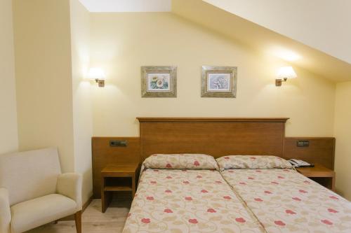 Ένα ή περισσότερα κρεβάτια σε δωμάτιο στο Hotel O Castro