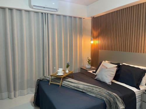 Ένα ή περισσότερα κρεβάτια σε δωμάτιο στο Loft encantador e refinado