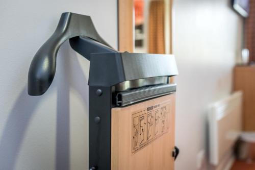 a knife is on top of a refrigerator at High Range Lodge Hotel in Aviemore