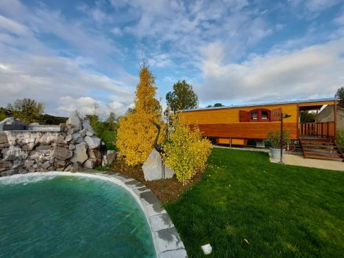 a house with a swimming pool in a yard at Hôtel du Domaine de La Grange de Condé in Condé-Northen