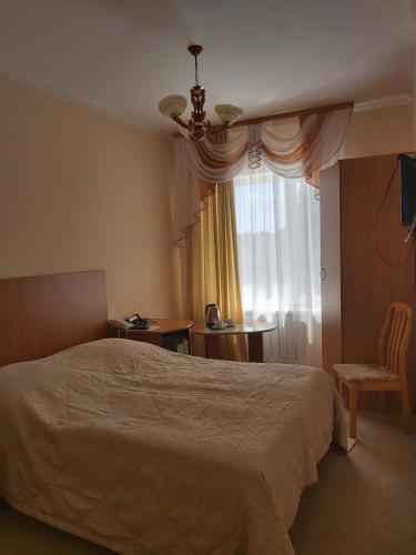 Posteľ alebo postele v izbe v ubytovaní Отель Ак Булак