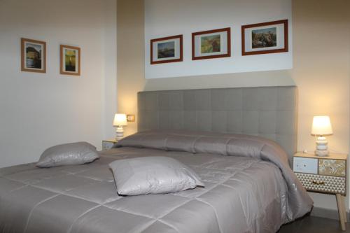 a bedroom with a bed with two pillows on it at B&B 80056 Ercolano in Ercolano