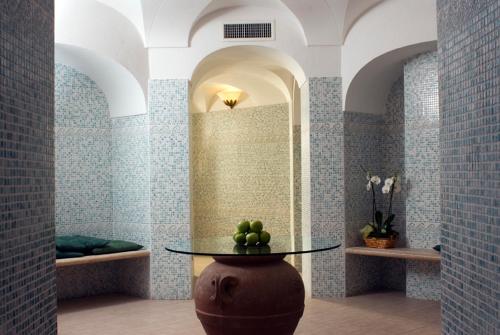 a room with a table with green apples on it at Hotel Terme Villa Teresa in Ischia