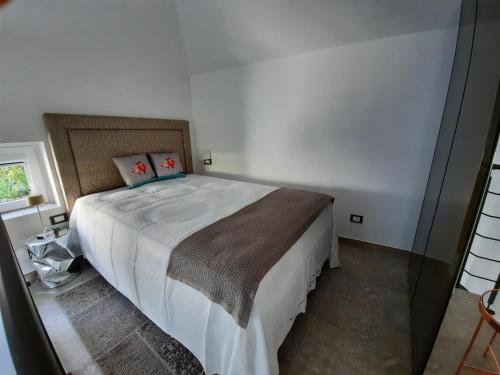 Postel nebo postele na pokoji v ubytování Palms Luxury Suites Sanremo