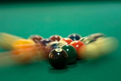 a group of billiard balls on a green table at Hotel Terme Villa Teresa in Ischia