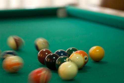 a group of billiard balls on a pool table at Hotel Terme Villa Teresa in Ischia