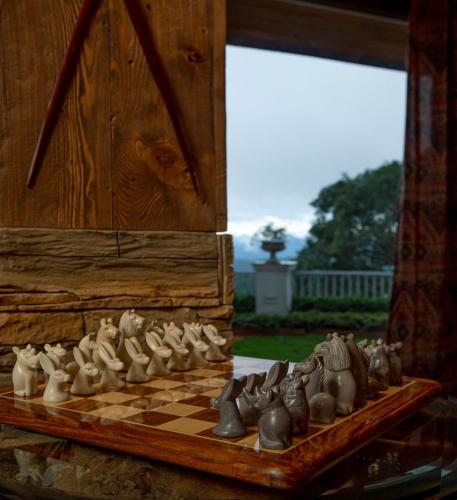 a chess board with a group of figurines on it at Daleside Manor, Boutique Hotel, Kasauli in Kasauli