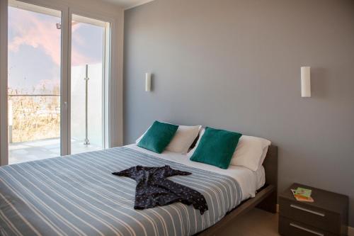 a bedroom with a bed with a t shirt on it at Residence Sunrise in Cesenatico