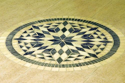 a tile floor with a design on the floor at Hotel Terme Villa Teresa in Ischia