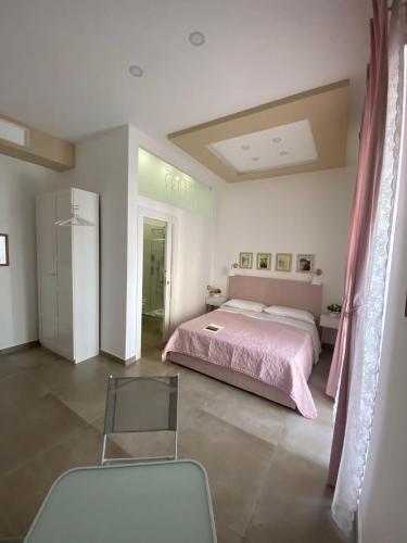 Ένα ή περισσότερα κρεβάτια σε δωμάτιο στο B&B 80056 Ercolano