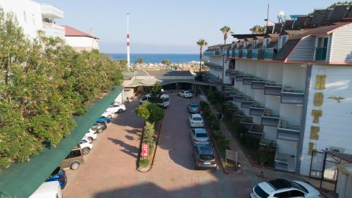 an aerial view of a parking lot next to a building at Unluselek Hotel in Anamur
