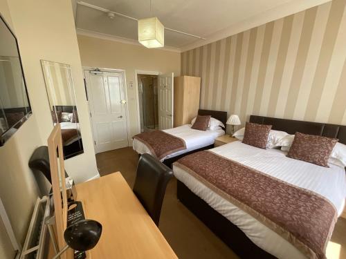 Ein Bett oder Betten in einem Zimmer der Unterkunft Alexanders