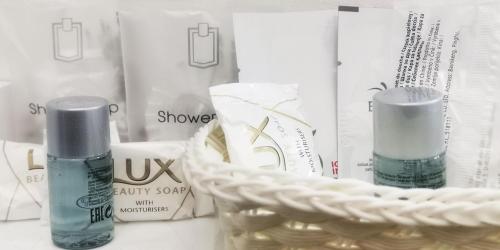 a pile of products on a table with a basket at Hotel Costa in Bari