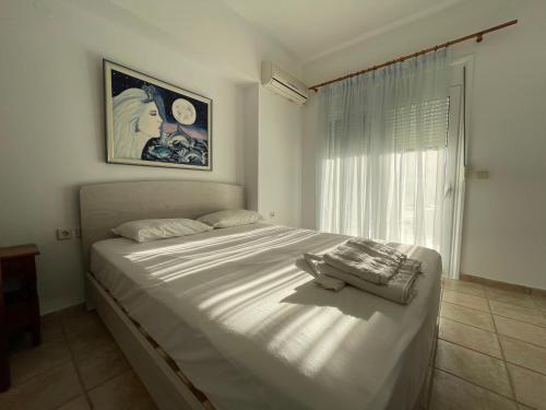 En eller flere senge i et værelse på Kaya Sea Apts - Stegna Beach