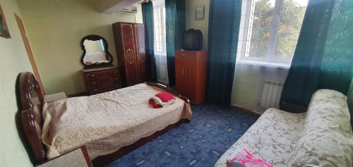 Giường trong phòng chung tại Гостевой дом "Мегаполис"