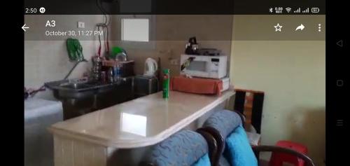 a kitchen with a counter top and a sink at Deluxe,New Chalet in North Coast Egypt in Dawwār Muşādif Yūnus
