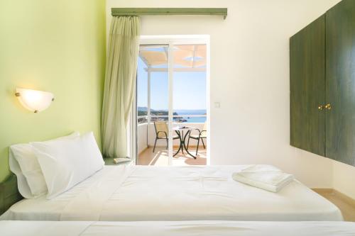 Posteľ alebo postele v izbe v ubytovaní Eolos Apartments