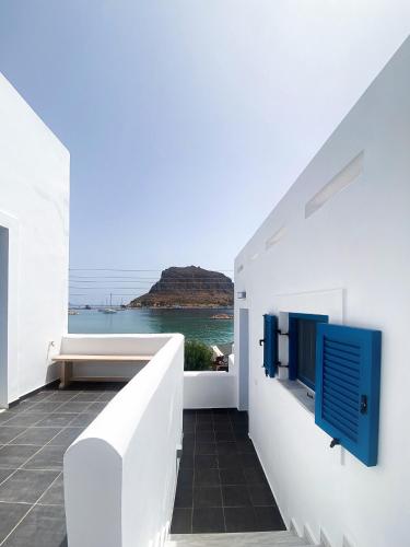 a white house with a view of the ocean at LULU - Self Catering Accommodation in Monemvasia