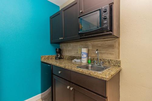 a kitchen with a sink and a microwave at Landmark 618 in Myrtle Beach