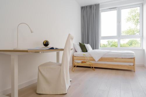 Posteľ alebo postele v izbe v ubytovaní Apartament Wyspa Zieleni