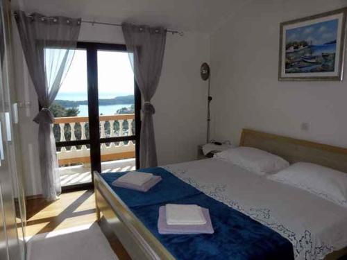 Postel nebo postele na pokoji v ubytování Apartments in Rab - Insel Rab 39950