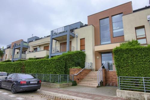 a car parked in front of a house at Apartments IN - Międzywodzie in Międzywodzie