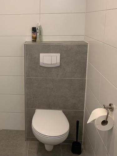 a bathroom with a white toilet and a sink at Roswitha-Gandersheim in Bad Gandersheim