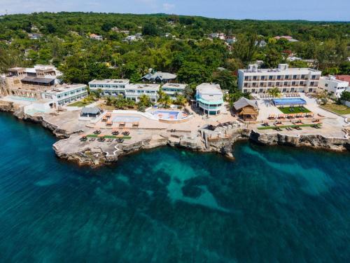 an aerial view of a resort on the water at Samsara Cliff Resort in Negril