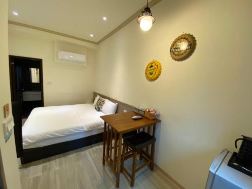 Ein Bett oder Betten in einem Zimmer der Unterkunft 育薦關山民宿 臺東縣民宿1585號